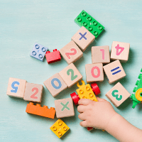 Child playing with numbered bricks