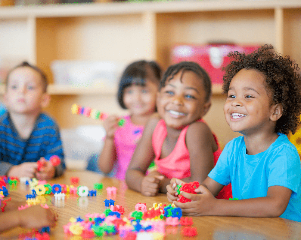 A diverse group of preschoolers in a classroom.