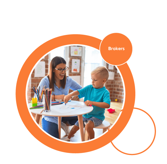 Woman and kid are drawing picture on the table