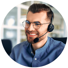 Customer service focused image showing man smiling with telephone headset on